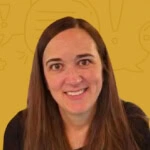 A person with long brown hair in a black shirt smiles against a mustard backdrop, representing Austin PR expertise and consulting.
