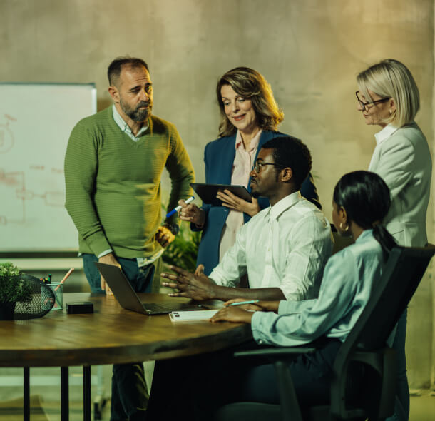 A group discussing Public Relations and Crisis Management in Austin, with social media consulting and press releases on laptops and tablets.
