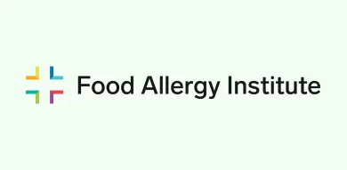 Logo of the Food Allergy Institute with a colorful cross, symbolizing expertise in Austin Public Relations and Crisis Management Consulting.