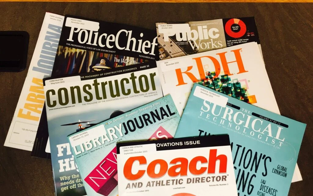 A spread of industry magazines showcasing Austin PR topics like consulting, crisis management, public relations, and social media.