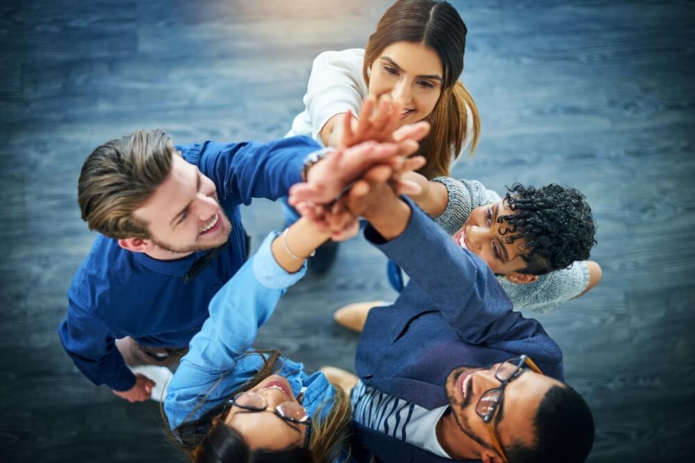 Five people in Austin demonstrating PR unity, embodying social media strategy, crisis management, and press release consulting.