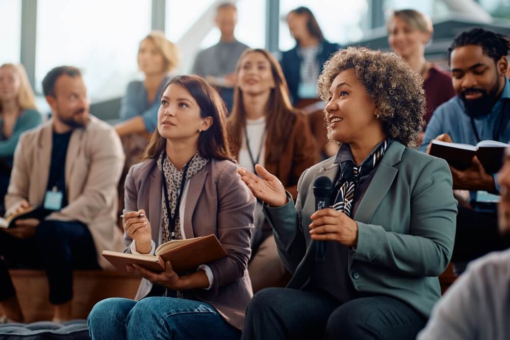 A business owner speaking publicly at a conference.